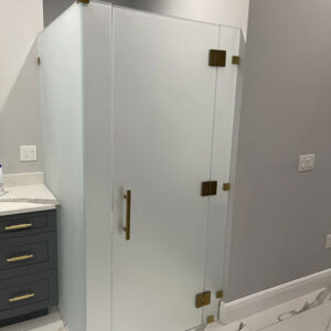 Frosted-Glass-Toilet-Partition-with-Brushed-Gold-Hardware