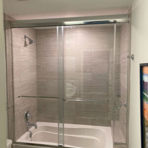 Semiframeless-no-wall-jams-with-fixed-panel-two-sliding-doors-tubular-towel-bars-chrome